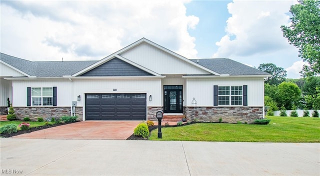 993 Pin Oaks Dr, Broadview Heights, OH 44147 - view of front of property with stone siding, a garage, a front yard, concrete driveway, and a shingled roof