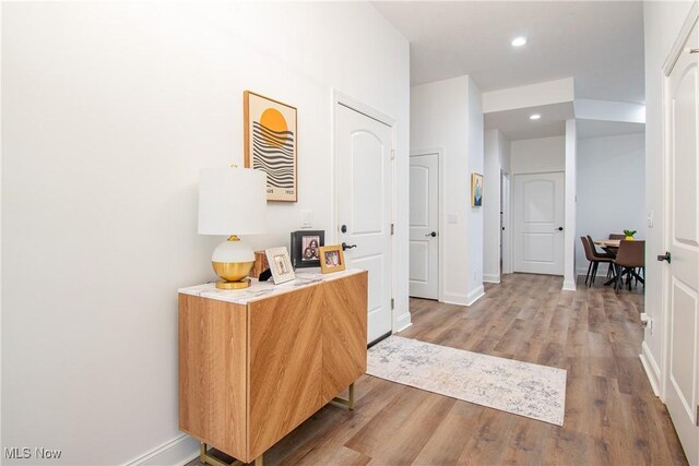 993 Pin Oaks Dr, Broadview Heights, OH 44147 - hallway featuring wood finished floors and recessed lighting