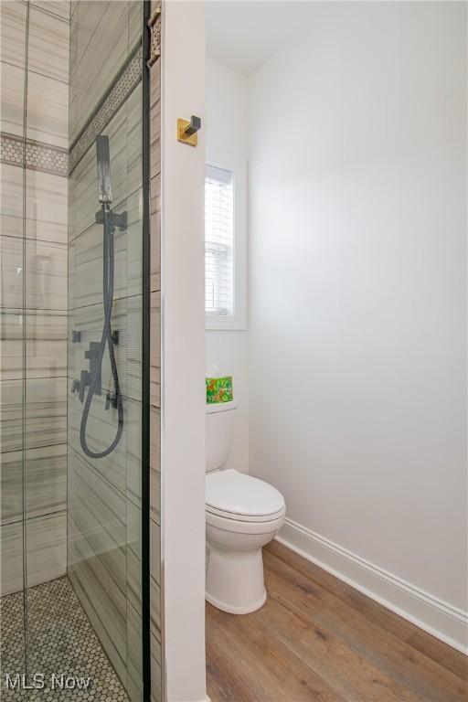 993 Pin Oaks Dr, Broadview Heights, OH 44147 - bathroom with a stall shower and wood finished floors