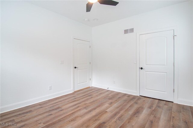 993 Pin Oaks Dr, Broadview Heights, OH 44147 - unfurnished bedroom with light wood-style flooring and ceiling fan