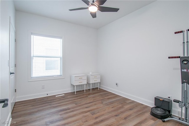 993 Pin Oaks Dr, Broadview Heights, OH 44147 - unfurnished bedroom featuring wood finished floors, multiple windows, and ceiling fan