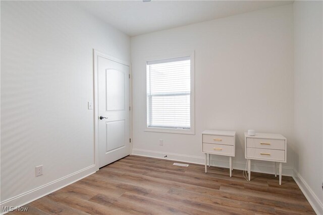 993 Pin Oaks Dr, Broadview Heights, OH 44147 - unfurnished bedroom with wood finished floors and baseboards