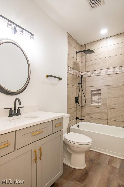 993 Pin Oaks Dr, Broadview Heights, OH 44147 - full bath featuring vanity, wood finished floors, and bathtub / shower combination