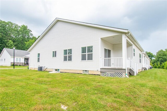 993 Pin Oaks Dr, Broadview Heights, OH 44147 - view of property exterior with a central air condition unit and a lawn