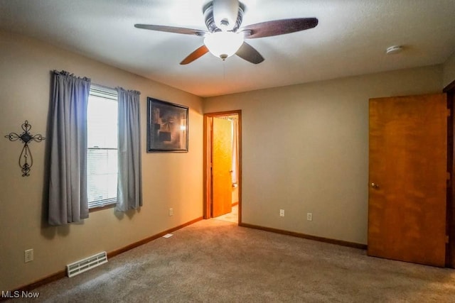 1769 Clearbrook Rd NW, Massillon, OH 44646 - unfurnished bedroom with multiple windows, carpet flooring, and ceiling fan