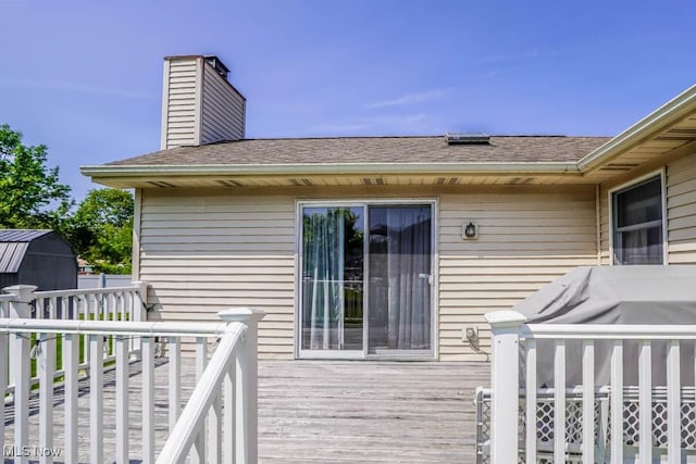 1769 Clearbrook Rd NW, Massillon, OH 44646 - wooden deck with a storage unit and grilling area