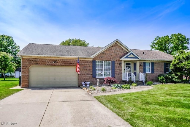 1769 Clearbrook Rd NW, Massillon, OH 44646 - view of front of property featuring driveway, an attached garage, a front lawn, and brick siding