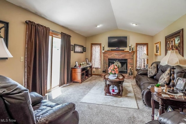 1769 Clearbrook Rd NW, Massillon, OH 44646 - living room featuring light carpet, vaulted ceiling, and a brick fireplace