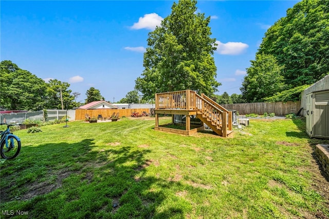 6086 N Wright St, Kingsville, OH 44048 - fenced backyard featuring stairs and a wooden deck