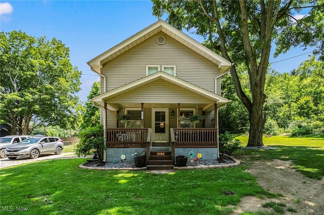 6086 N Wright St, Kingsville, OH 44048 - view of front of house featuring covered porch and a front yard
