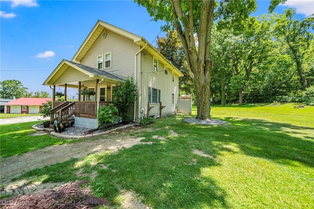 6086 N Wright St, Kingsville, OH 44048 - view of home's exterior with a porch and a lawn