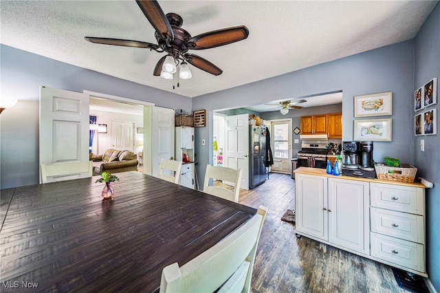 6086 N Wright St, Kingsville, OH 44048 - dining space featuring ceiling fan, wood finished floors, and a textured ceiling