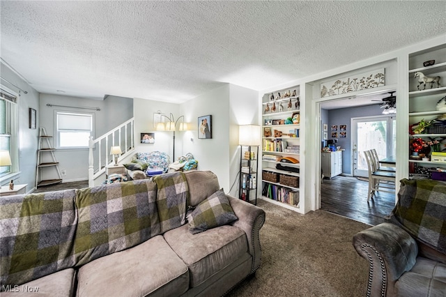 6086 N Wright St, Kingsville, OH 44048 - carpeted living room featuring stairway and a textured ceiling