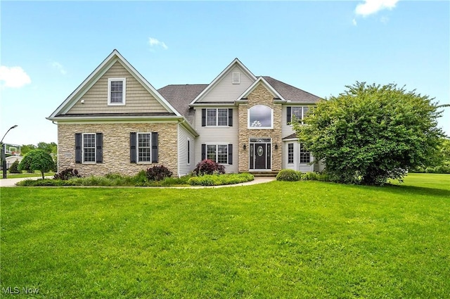 7305 Alexander Rd, Concord, OH 44077 - view of front of property with stone siding and a front lawn