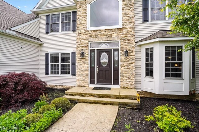 7305 Alexander Rd, Concord, OH 44077 - doorway to property featuring stone siding