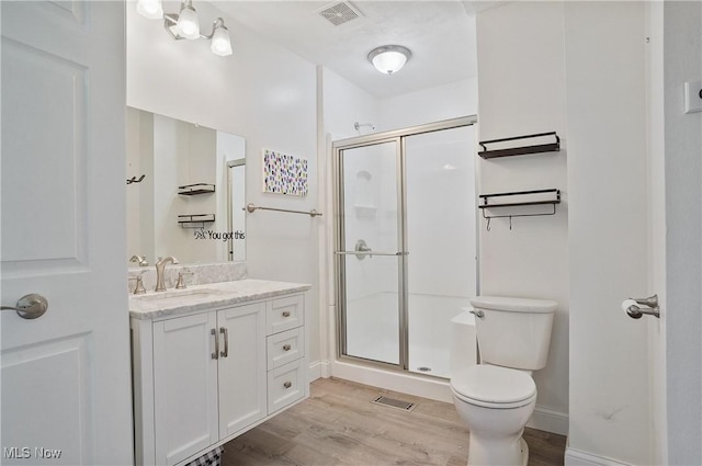 7305 Alexander Rd, Concord, OH 44077 - bathroom with vanity, wood finished floors, and a stall shower