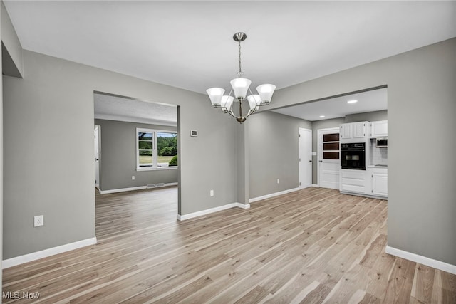 4928 Lane Rd, Perry, OH 44081 - unfurnished living room with light wood-style floors, a chandelier, and recessed lighting
