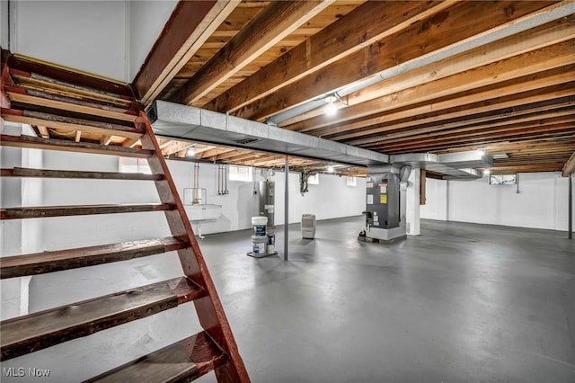4928 Lane Rd, Perry, OH 44081 - unfinished basement with stairway, heating unit, and water heater