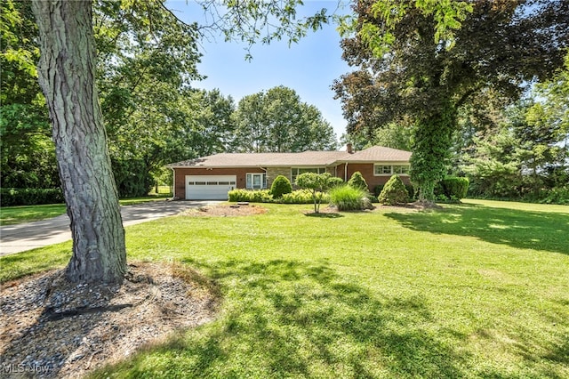 4928 Lane Rd, Perry, OH 44081 - single story home featuring brick siding, a garage, driveway, and a front lawn