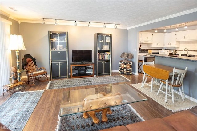 2021 King James Pkwy Unit 214, Westlake, OH 44145 - living room with rail lighting, crown molding, and dark wood-style floors