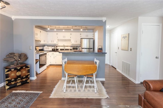 2021 King James Pkwy Unit 214, Westlake, OH 44145 - dining room featuring dark wood-type flooring, a textured ceiling, crown molding, and rail lighting