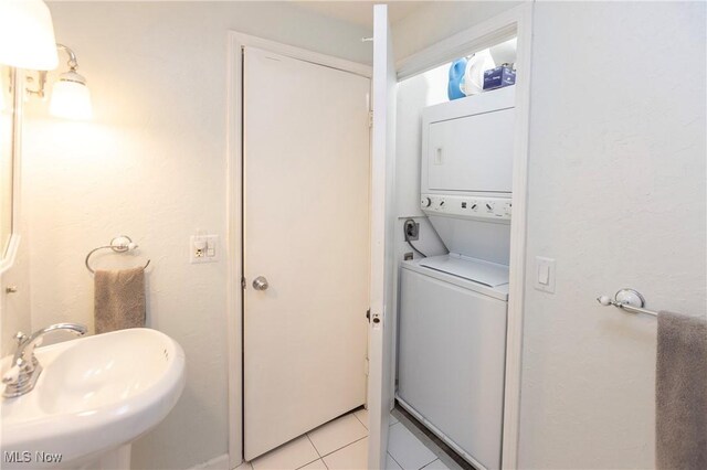 2021 King James Pkwy Unit 214, Westlake, OH 44145 - bathroom featuring stacked washing machine and dryer and tile patterned flooring