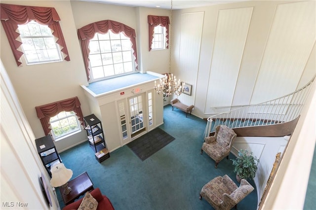 2021 King James Pkwy Unit 214, Westlake, OH 44145 - foyer entrance featuring carpet floors, a chandelier, and a high ceiling