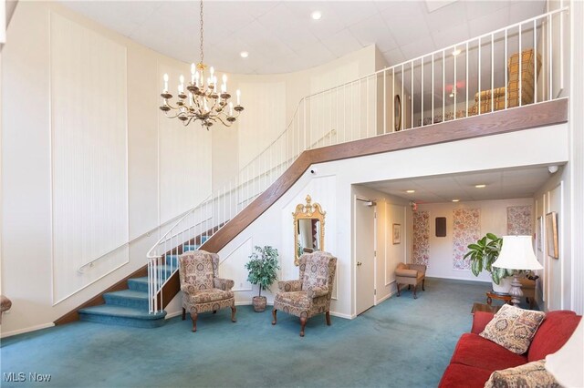 2021 King James Pkwy Unit 214, Westlake, OH 44145 - carpeted living area featuring a chandelier, stairway, a towering ceiling, and recessed lighting