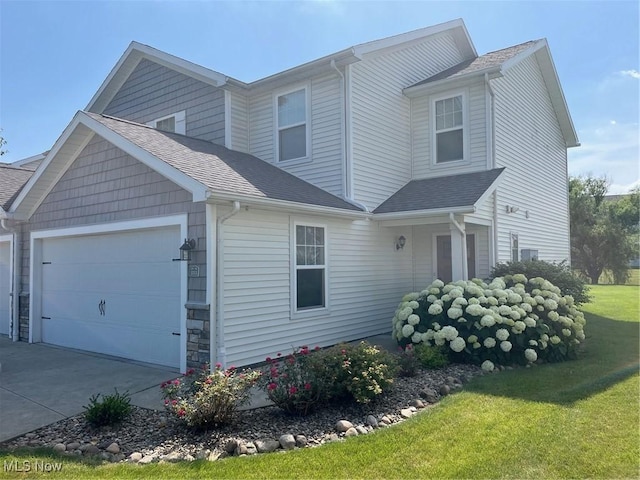 1315 Cascade Cir E, Canton, OH 44708 - view of front of property featuring a garage, driveway, a front yard, and a shingled roof