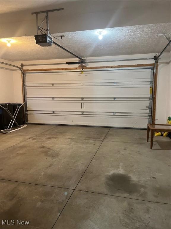 1315 Cascade Cir E, Canton, OH 44708 - garage featuring a garage door opener