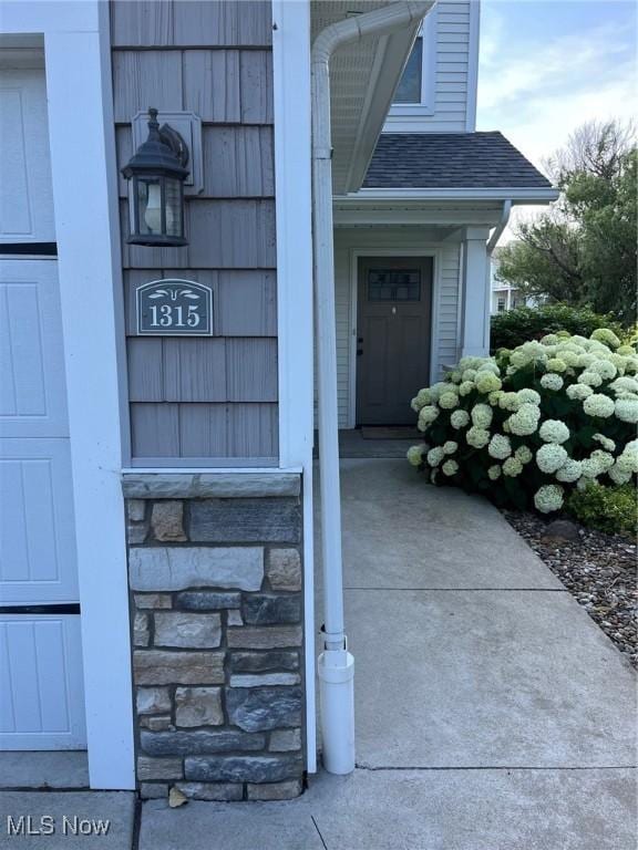 1315 Cascade Cir E, Canton, OH 44708 - doorway to property featuring stone siding