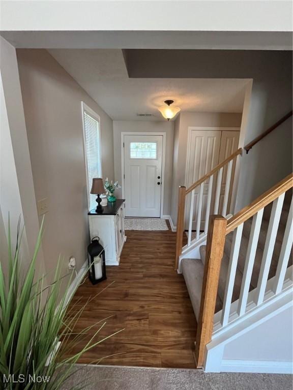 1315 Cascade Cir E, Canton, OH 44708 - foyer with dark wood-style floors and stairs