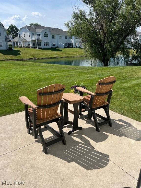 1315 Cascade Cir E, Canton, OH 44708 - view of patio with a water view and a residential view