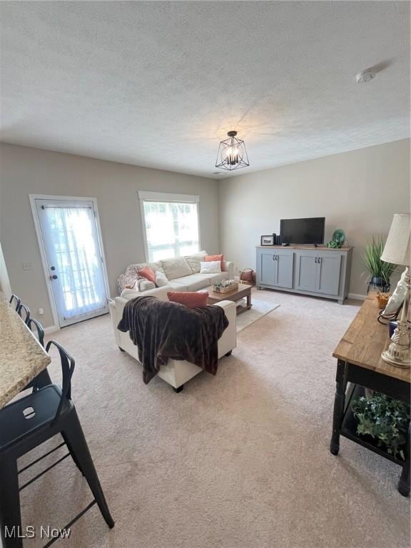 1315 Cascade Cir E, Canton, OH 44708 - living area with light colored carpet and a textured ceiling