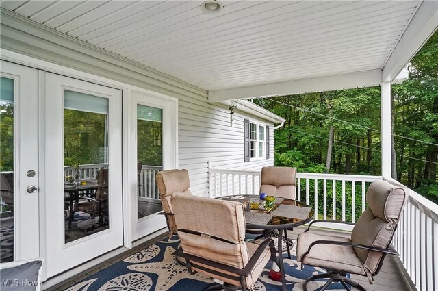 47688 Tomahawk Dr, Negley, OH 44441 - wooden deck with french doors and outdoor dining space