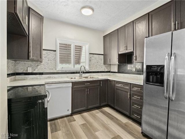 3792 E 149th St, Cleveland, OH 44128 - kitchen featuring stainless steel fridge, white dishwasher, light wood-style floors, a textured ceiling, and dark brown cabinetry