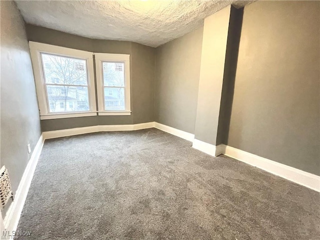 10003 Empire Ave, Cleveland, OH 44108 - carpeted spare room featuring baseboards and a textured ceiling