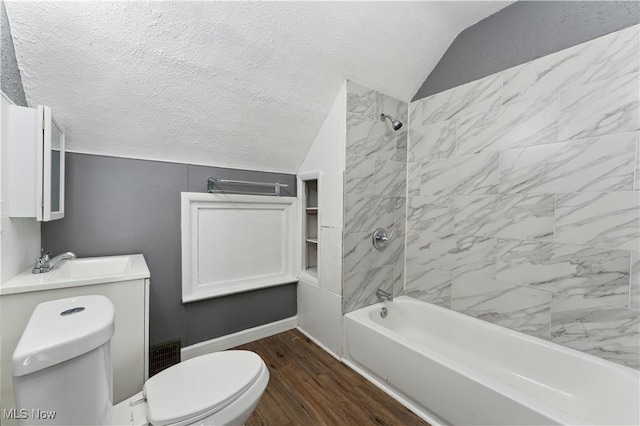 4002 Ardmore Ave, Cleveland, OH 44109 - bathroom with shower / tub combination, vaulted ceiling, a textured ceiling, and wood finished floors