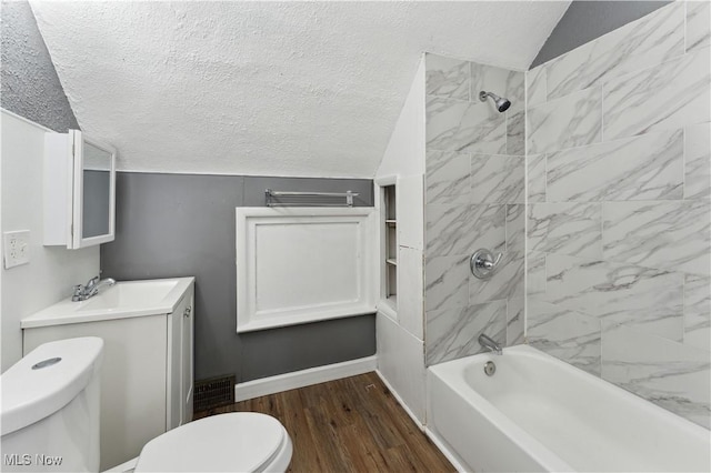 4002 Ardmore Ave, Cleveland, OH 44109 - full bath featuring a textured ceiling, lofted ceiling, shower / washtub combination, wood finished floors, and vanity
