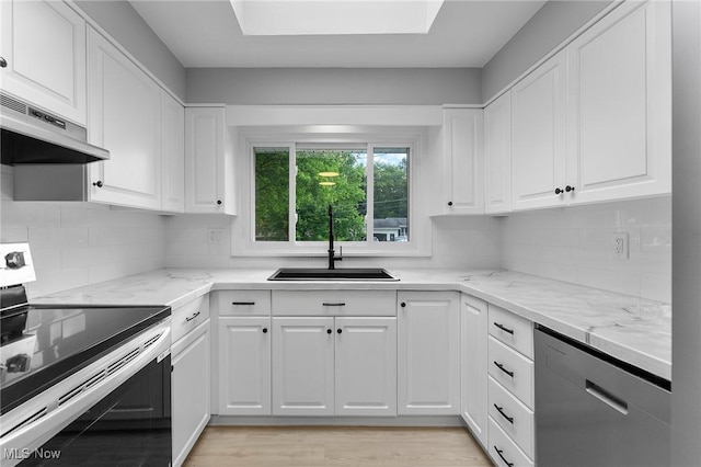 70 Maple St, Canfield, OH 44406 - kitchen with stainless steel appliances, exhaust hood, and white cabinets