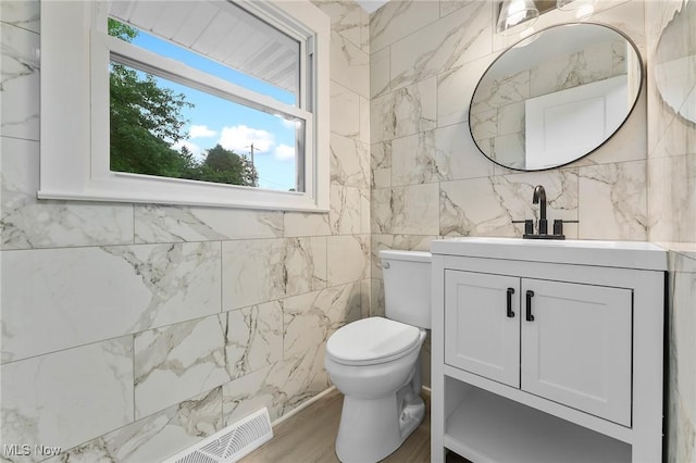 70 Maple St, Canfield, OH 44406 - bathroom featuring vanity, plenty of natural light, and tile walls