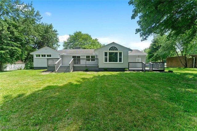 70 Maple St, Canfield, OH 44406 - back of property featuring a wooden deck and a lawn