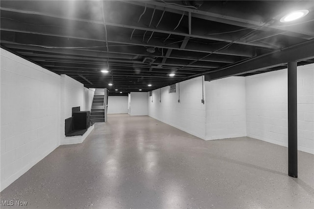 70 Maple St, Canfield, OH 44406 - finished basement with stairway and concrete block wall