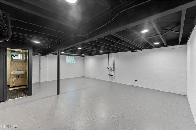 70 Maple St, Canfield, OH 44406 - below grade area with concrete block wall and a sink