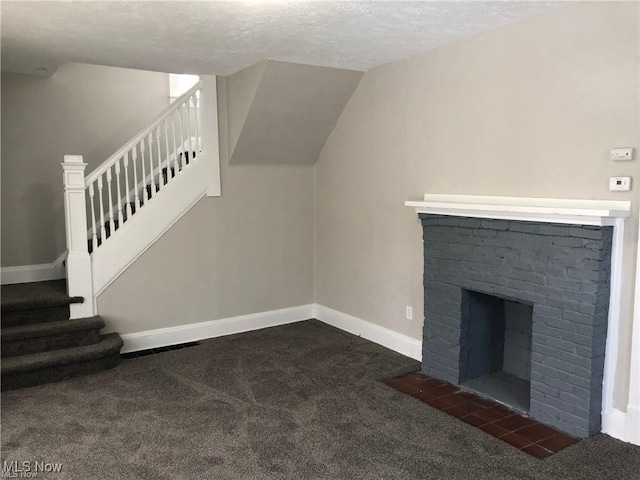 3390 E 135th St, Cleveland, OH 44120 - unfurnished living room with carpet floors, stairway, a fireplace, and a textured ceiling