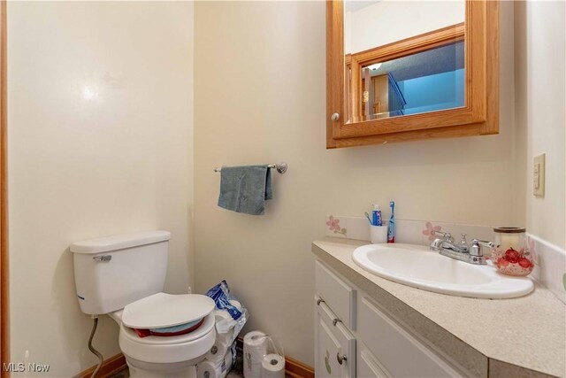 1715 High St, Louisville, OH 44641 - bathroom with vanity and toilet