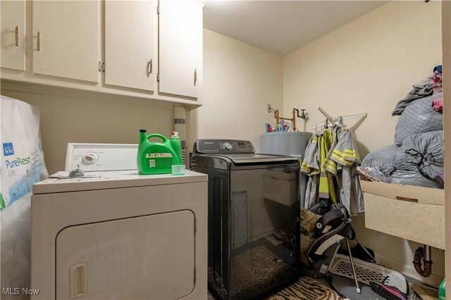 1715 High St, Louisville, OH 44641 - laundry area with washing machine and clothes dryer and cabinet space