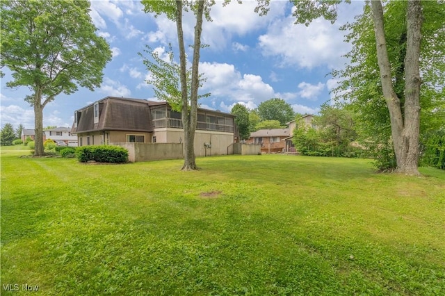 1715 High St, Louisville, OH 44641 - view of grassy yard featuring a sunroom