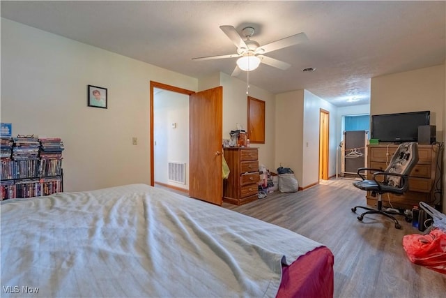 1715 High St, Louisville, OH 44641 - bedroom featuring wood finished floors and a ceiling fan