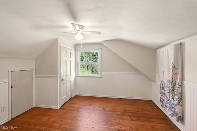 5105 E Sprague Rd, Independence, OH 44131 - bonus room featuring vaulted ceiling, ceiling fan, hardwood / wood-style flooring, a textured ceiling, and wainscoting
